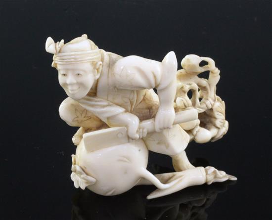 A Japanese ivory okimono of a farmer cutting a large turnip, signed Gyokushi, late 19th / early 20th century, 7cm, slight restorations